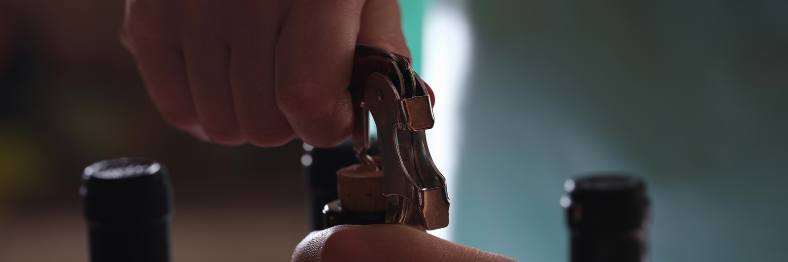 Wine being opened with a bottle opener
